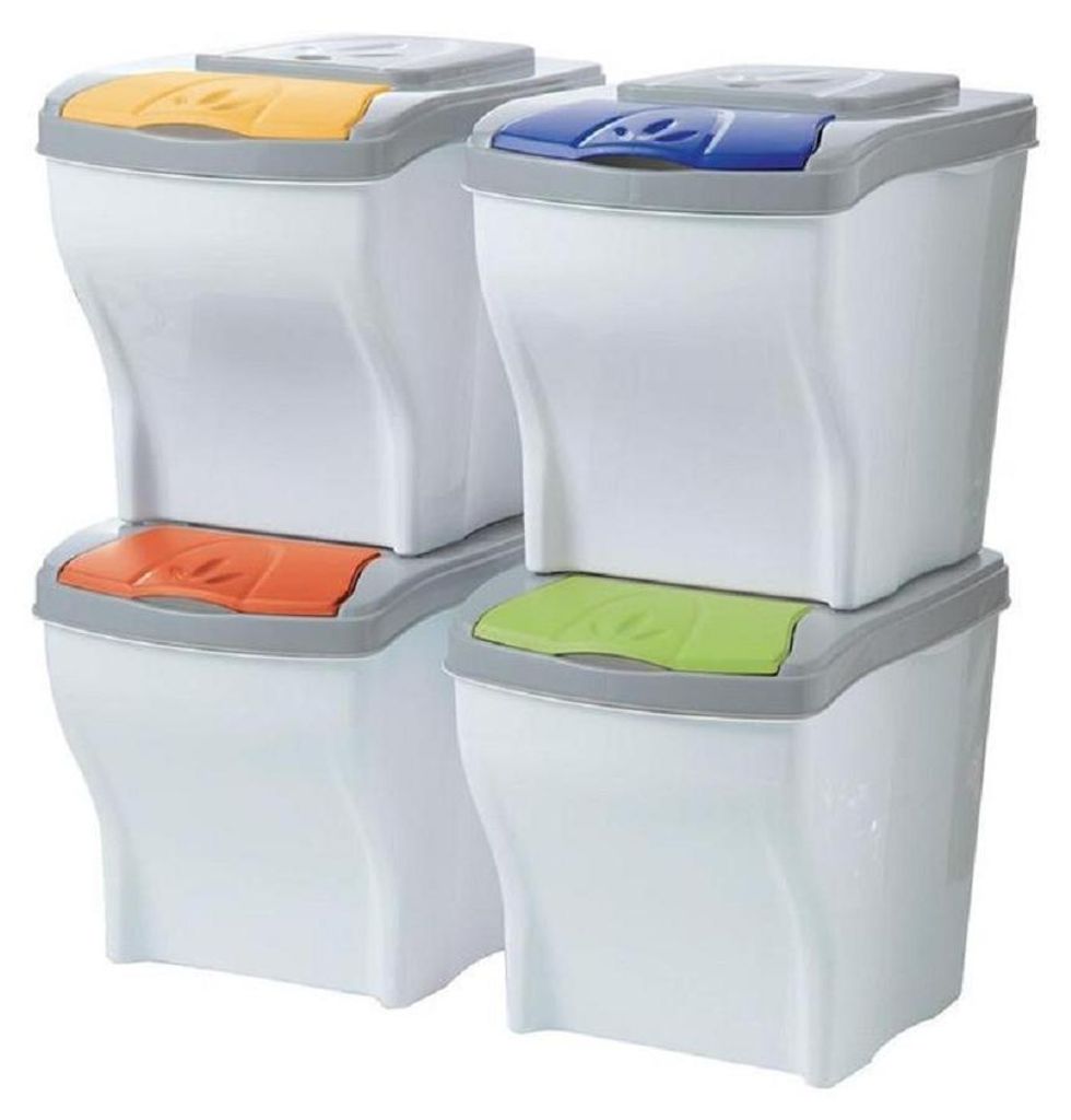 Four stacked recycling bins with different colored lids.