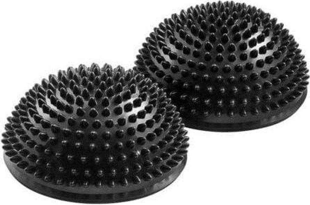 Two black spiky balance balls on a white background.
