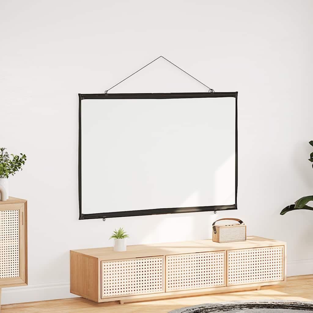 A projection screen is hung on a white wall above a wooden media console.