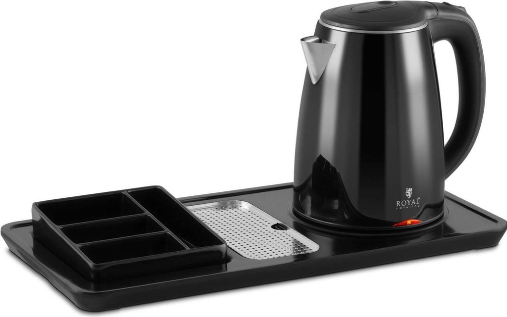 A black electric kettle and a black organizer tray are placed on a black tray.