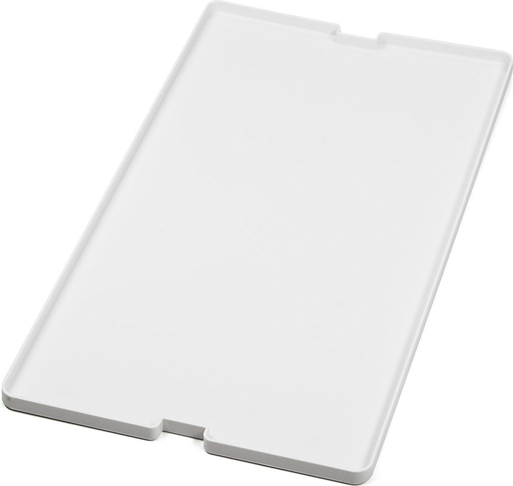 A white plastic tray with cutouts on two sides, shown at an angle on a white background.