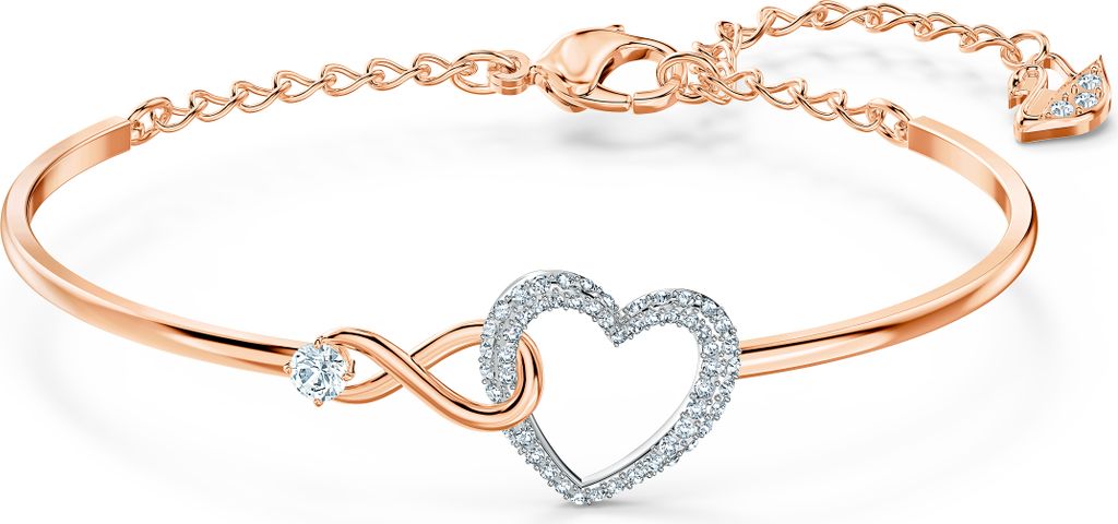 A rose gold bracelet with an infinity symbol and a heart charm, adorned with clear crystals, is displayed on a white background.
