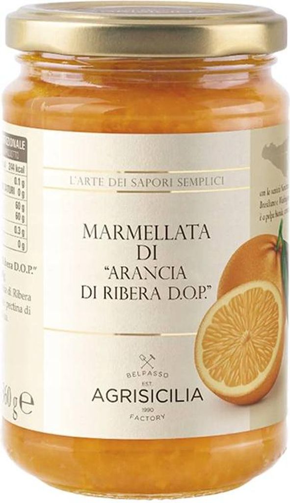 A jar of orange marmalade on a white background.