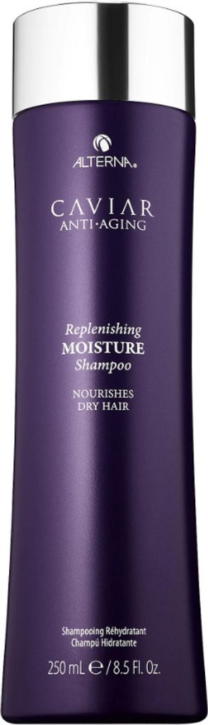 A product shot of a purple shampoo bottle with a silver cap.