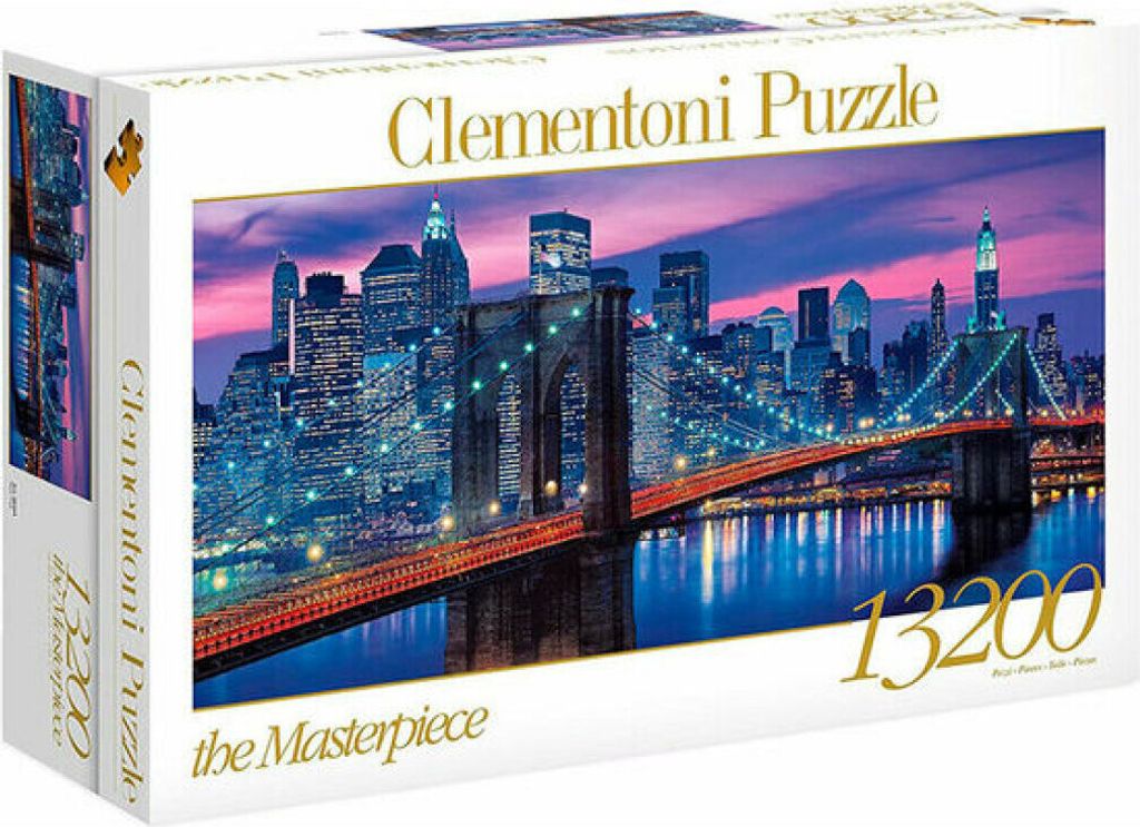 A Clementoni puzzle box featuring a nighttime view of the Brooklyn Bridge and the New York City skyline.