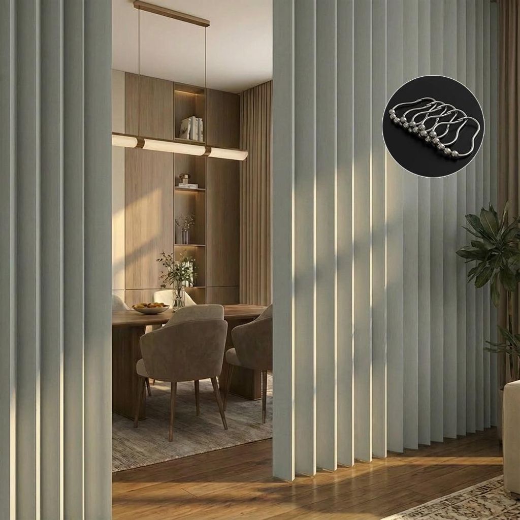 A dining room with a partition and a glimpse of a table and chairs.