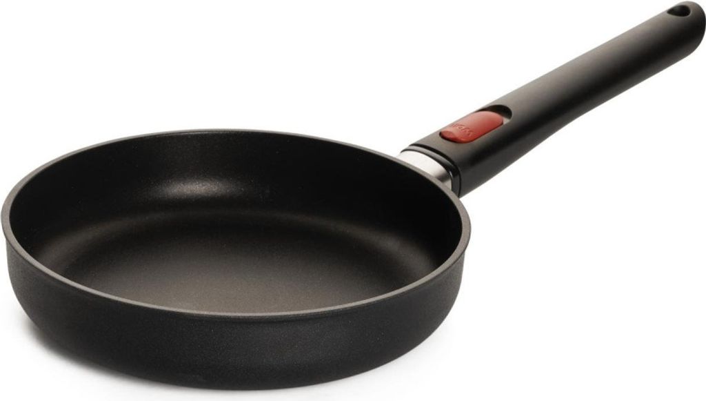 A black frying pan with a black handle and a red accent on the handle, shown against a white background.