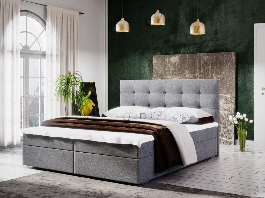 A bedroom scene featuring a bed with storage.