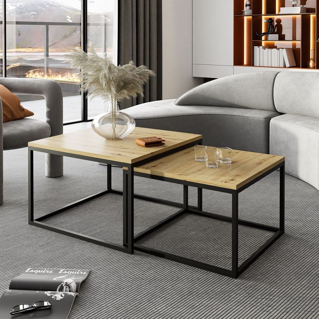 A living room scene with a sectional sofa, coffee tables, and a large window.