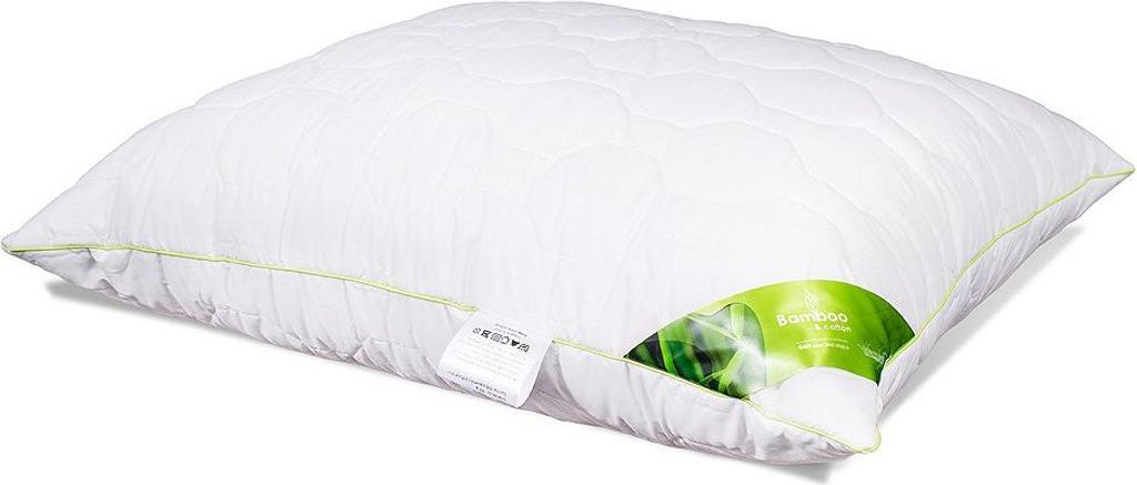 A white quilted pillow with a green and white label showing bamboo stalks.
