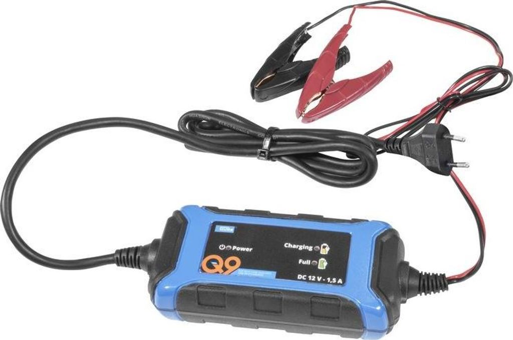 A battery charger with its cables and clips is shown against a white background.
