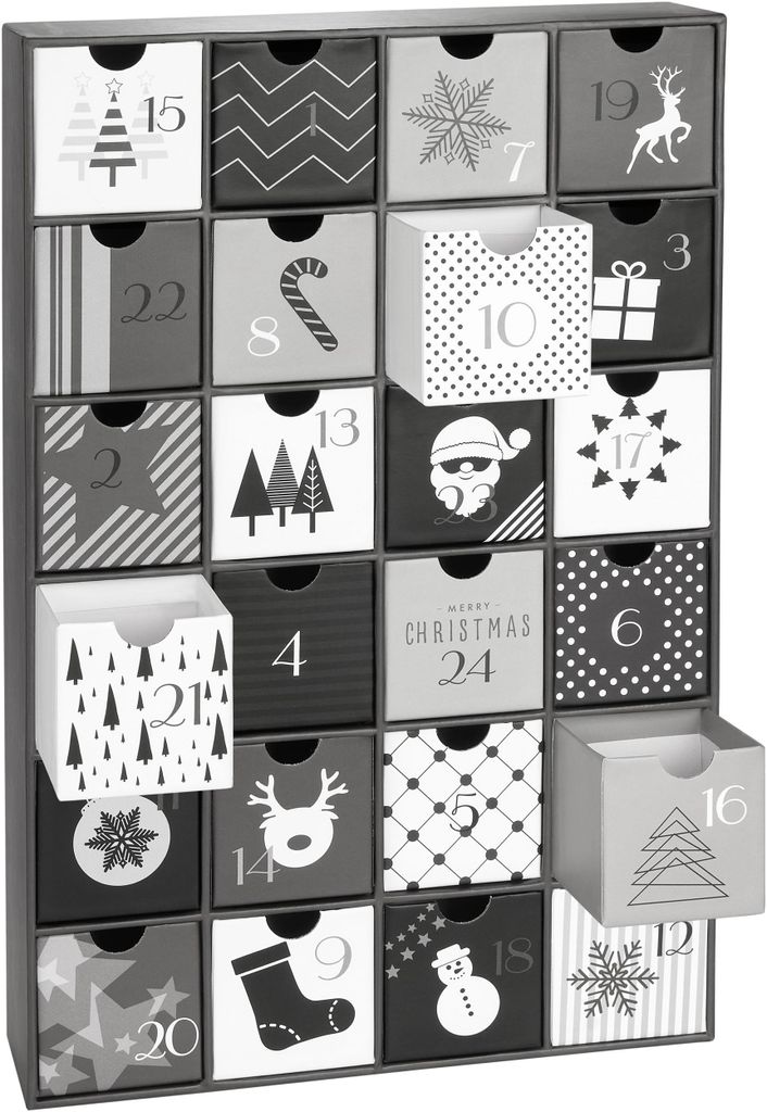 A black and white advent calendar with 24 numbered drawers, some of which are open.
