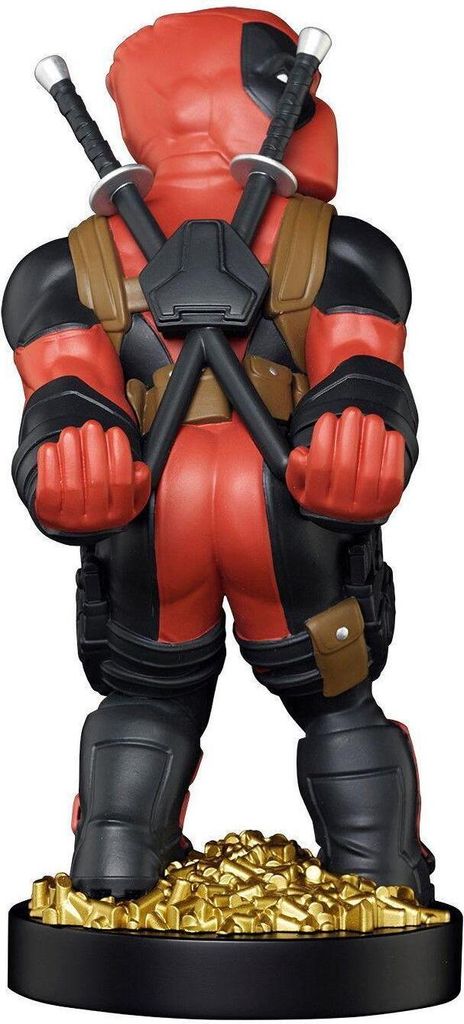A back view of a Deadpool figurine standing on a pile of gold coins.