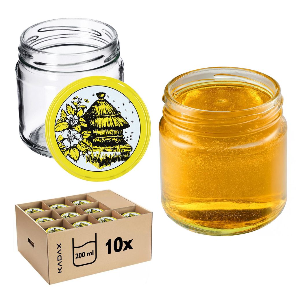 A collection of glass jars for preserves, some filled with honey, and a box of 10 jars.
