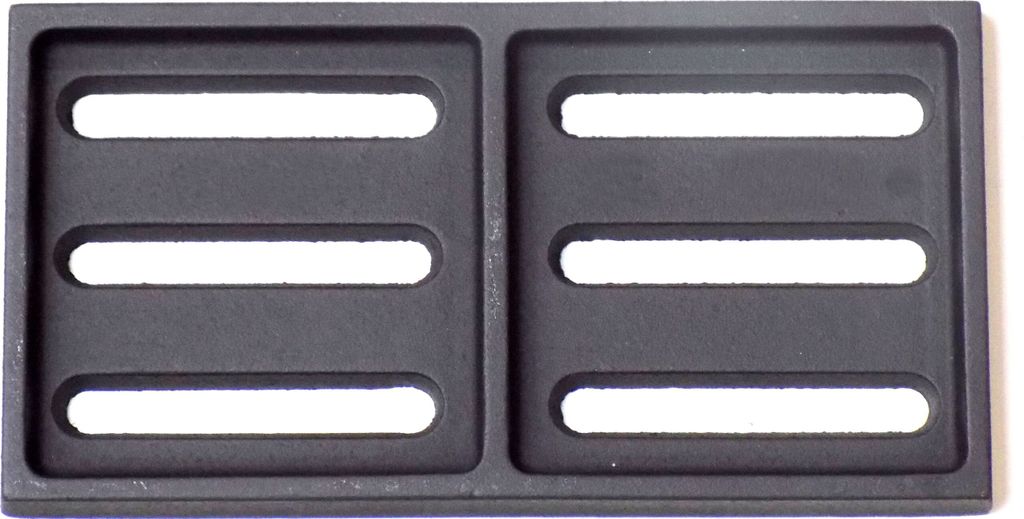 A dark gray, rectangular grate with six horizontal slots is shown against a white background.