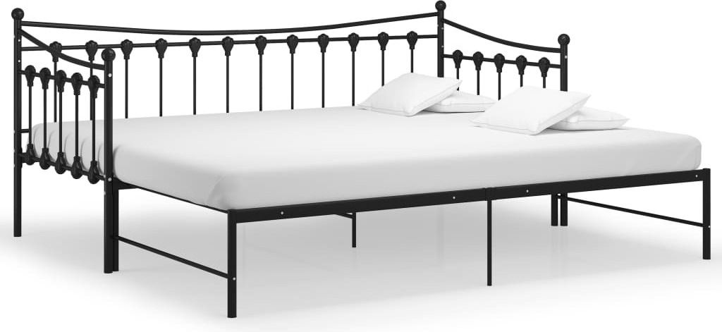 A black metal daybed with a white mattress and three white pillows.