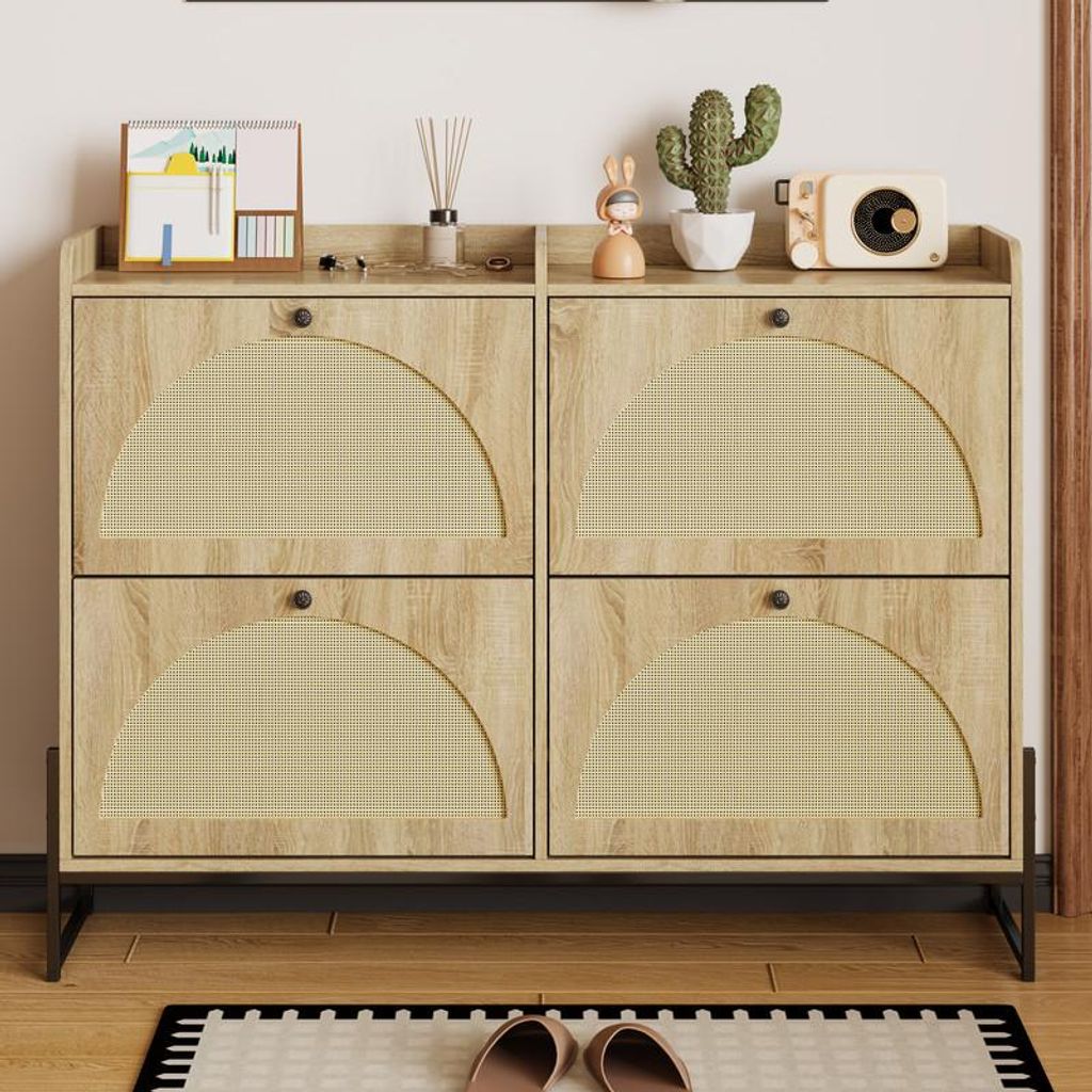 A shoe cabinet with four flip-down doors, decorated with small items on top, placed in a hallway or entryway.