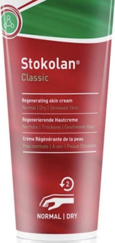 A close-up of a red tube of Stokolan Classic regenerating skin cream.