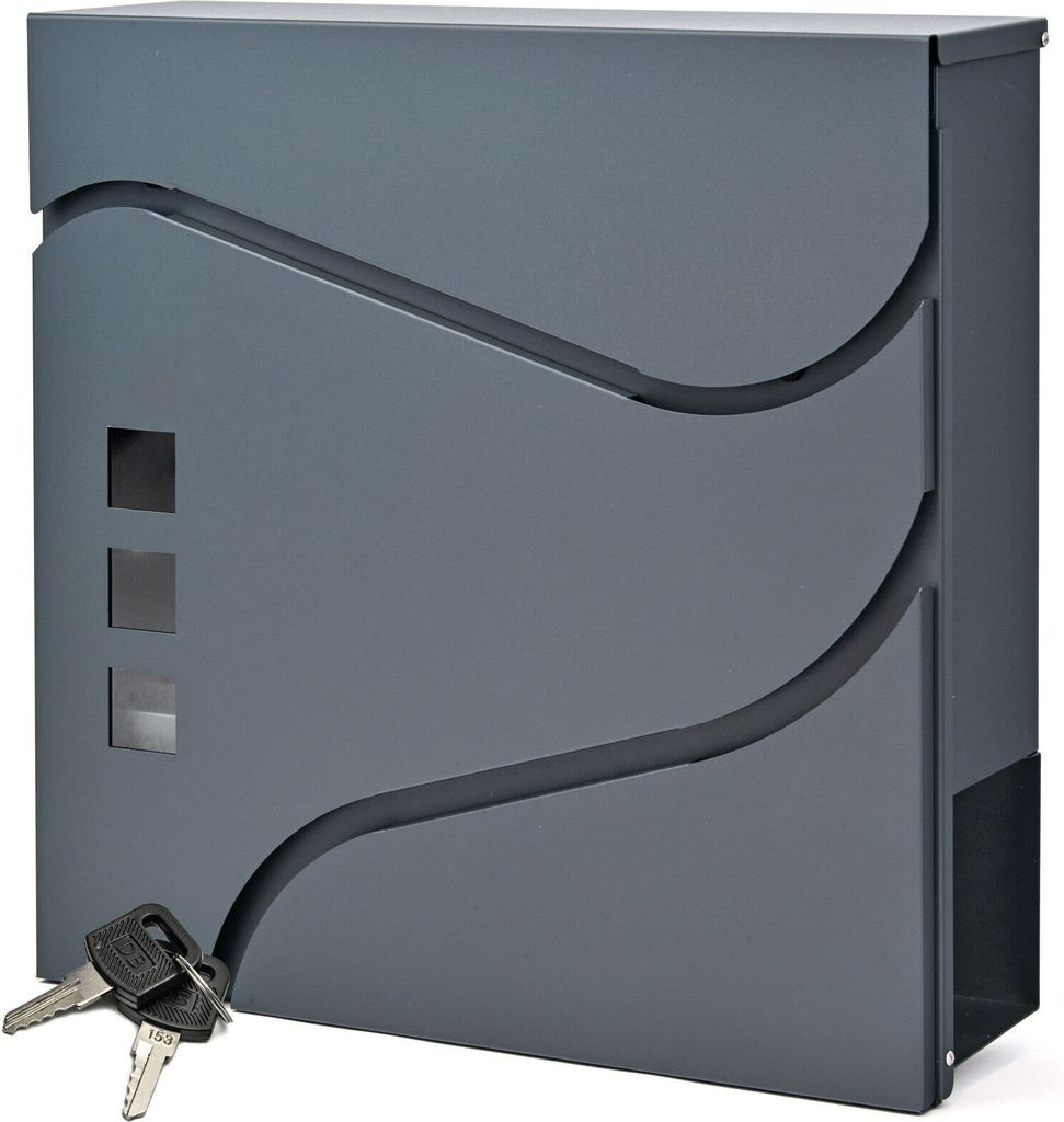 A gray mailbox with decorative cutouts and keys in the foreground.