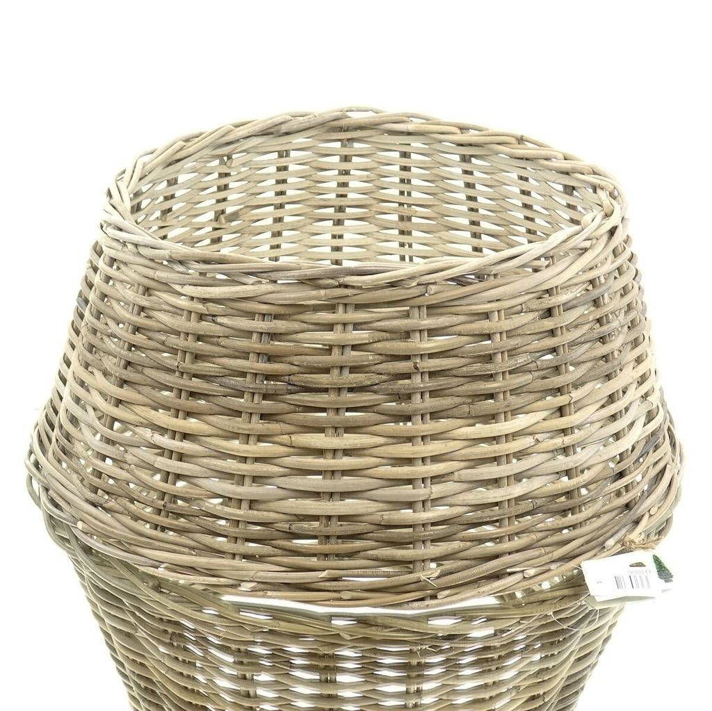 A close-up view of the top of a woven rattan Christmas tree stand cover.