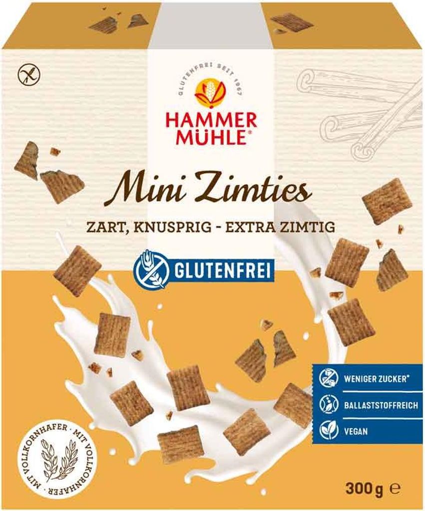 A product box for Hammermühle Mini Zimties cereal, showing the cereal pieces splashing into milk.