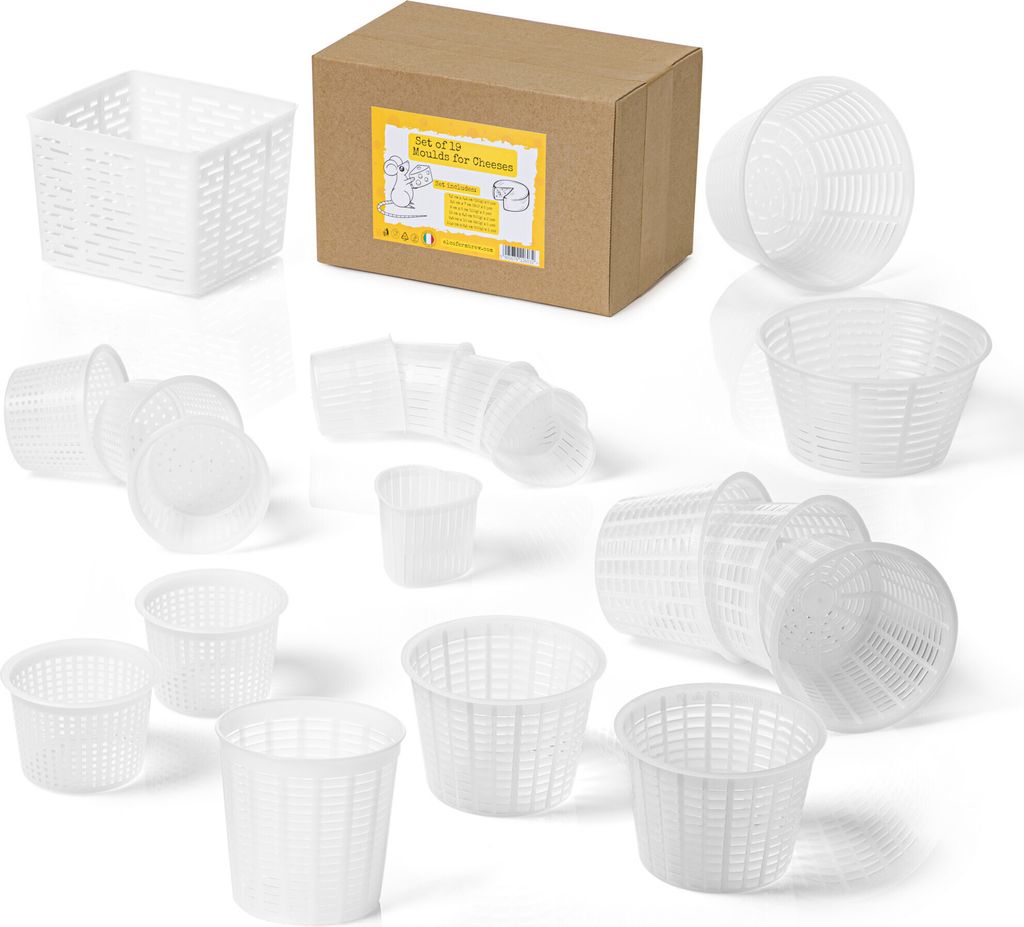 A collection of white plastic cheese molds of various sizes, along with a cardboard box containing some of the molds.