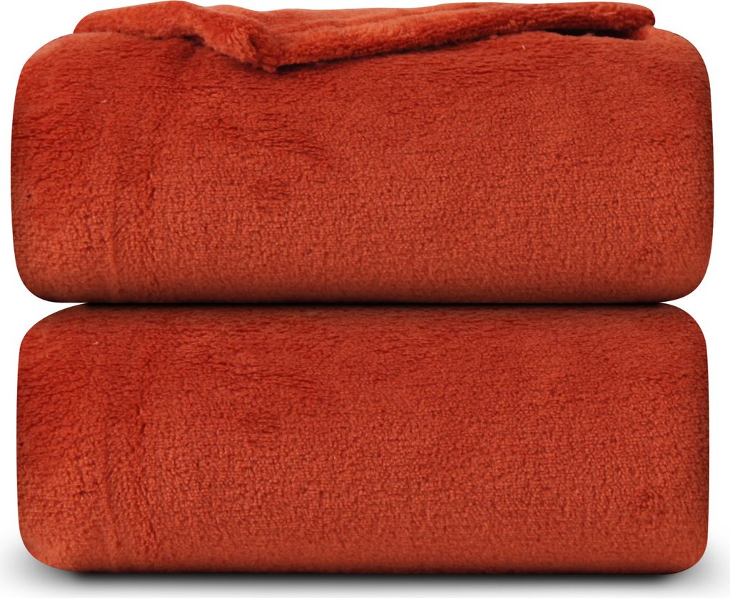 Two folded blankets stacked on top of each other.