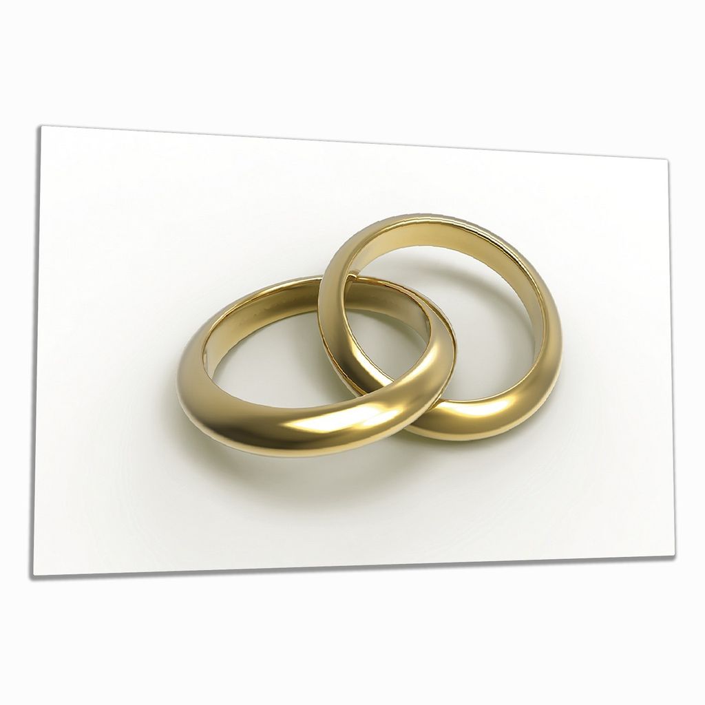 Wallario Herdabdeckplatte aus Glas, Größe 90 x 52 cm 1-teilig, Motiv Zwei goldene Eheringe in Nahaufnahme auf weißem Grund