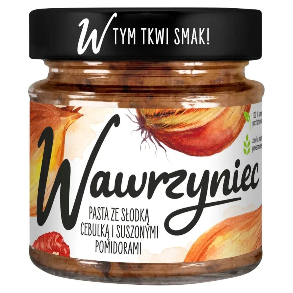 A jar of pasta sauce with onions and dried tomatoes.