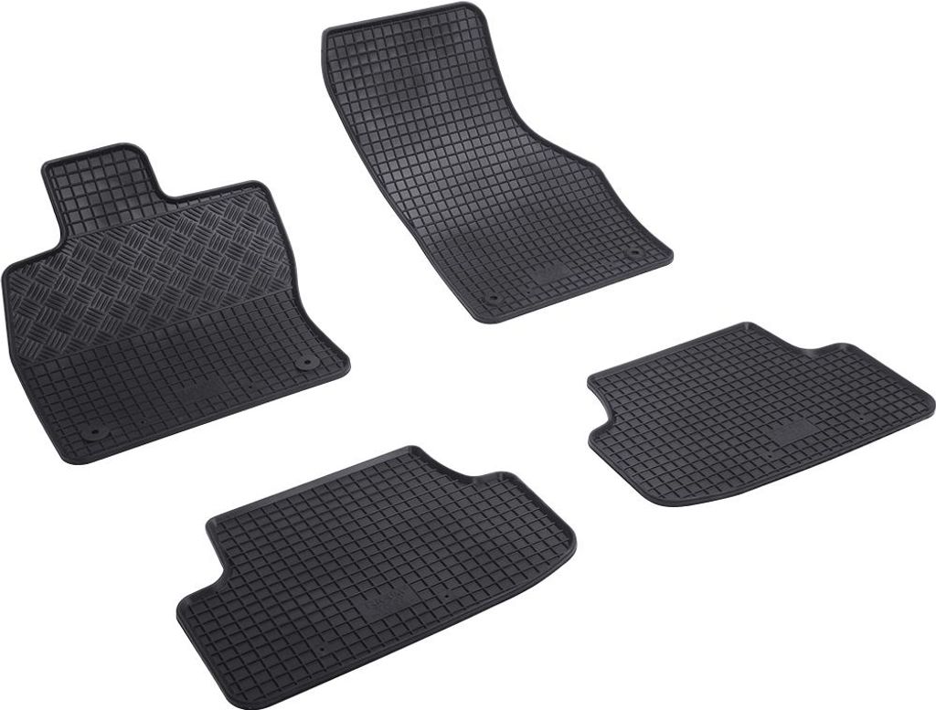 A set of four black rubber car floor mats arranged on a white background.