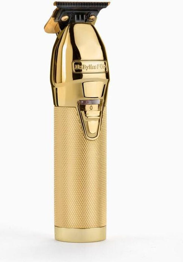 A close-up studio shot of a gold hair trimmer against a white background.