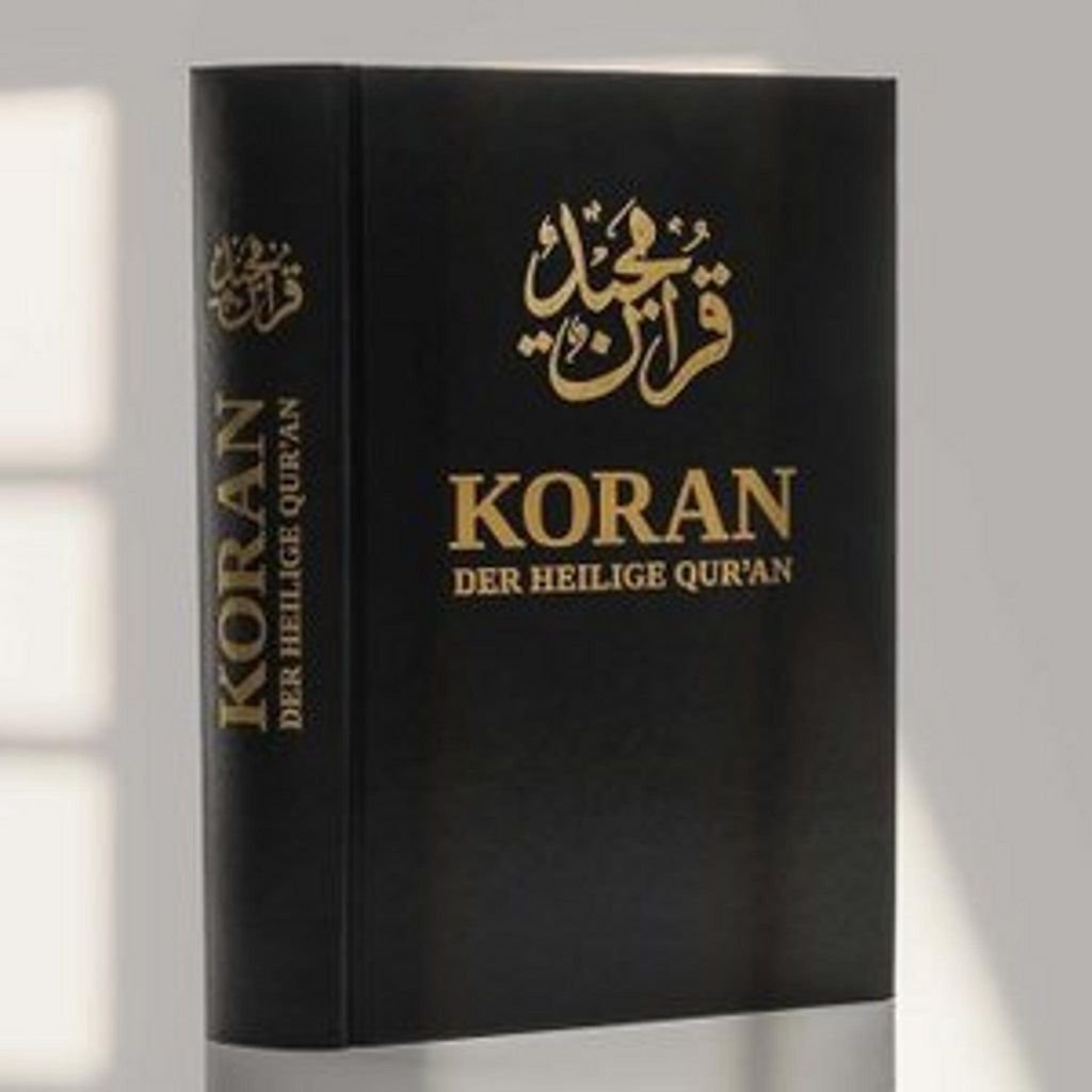A black book with gold lettering, likely a religious text, is shown against a light gray background with soft shadows.