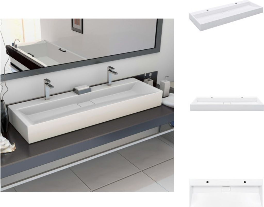 A modern bathroom sink with two faucets and a mirror above.