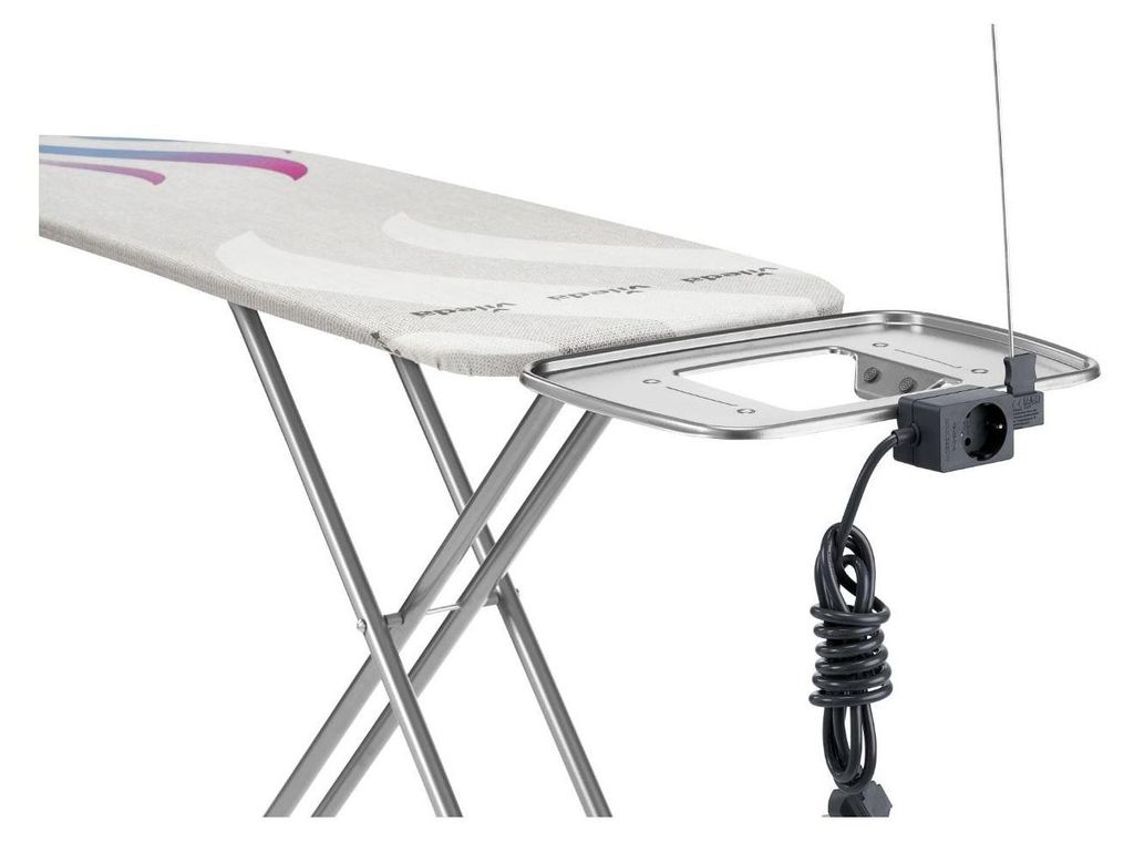 A close-up view of an ironing board with an attached electrical outlet and cord.