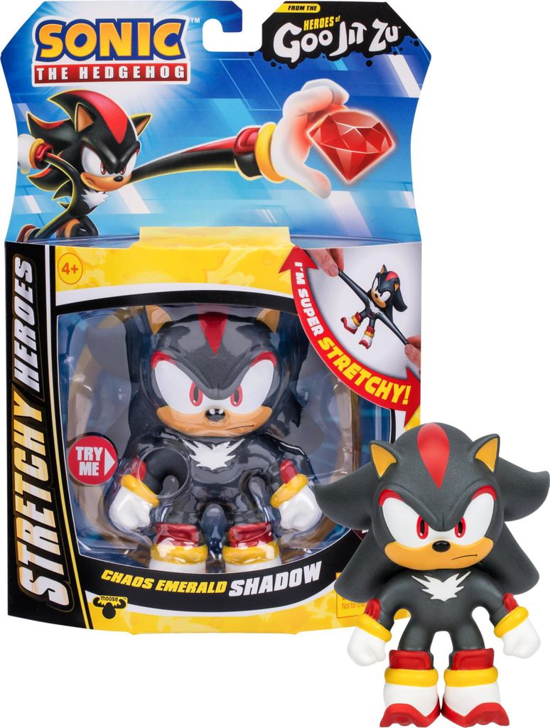 The image shows the packaging of a Heroes of Goo Jit Zu Sonic the Hedgehog Chaos Emerald SHADOW Stretchy Hero toy. The packaging is colorful and features graphics of the character. A smaller, out-of-package figure is also shown next to the packaging.