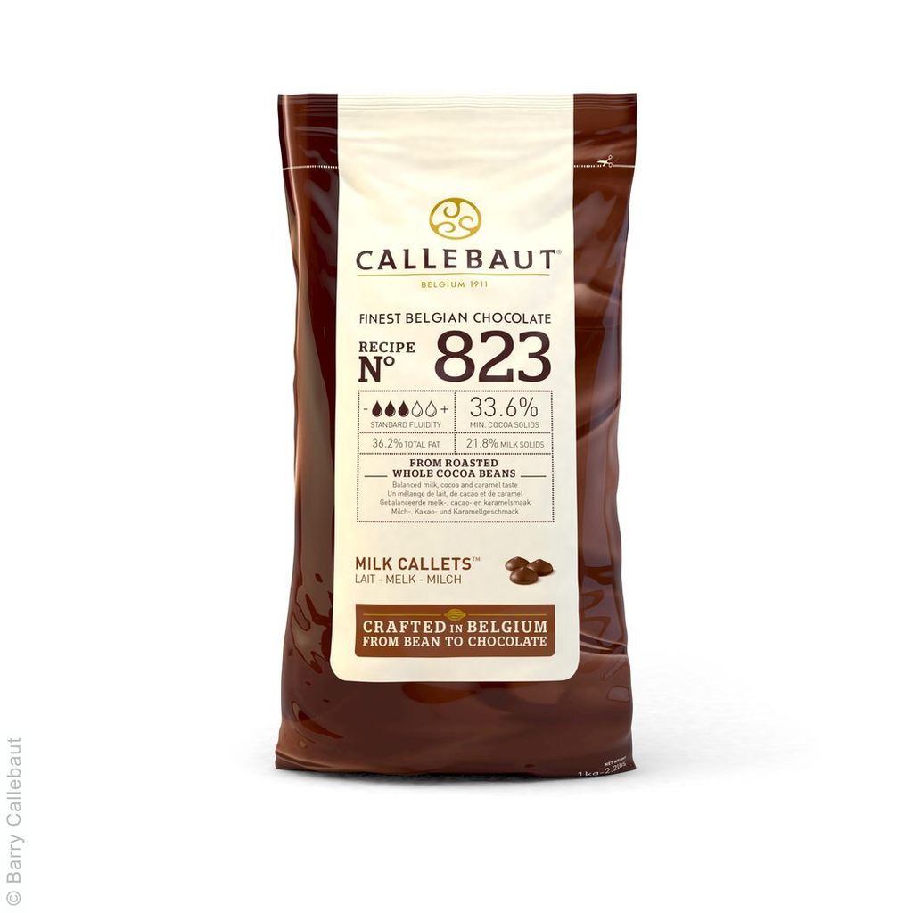 A bag of Callebaut milk chocolate callets on a white background.