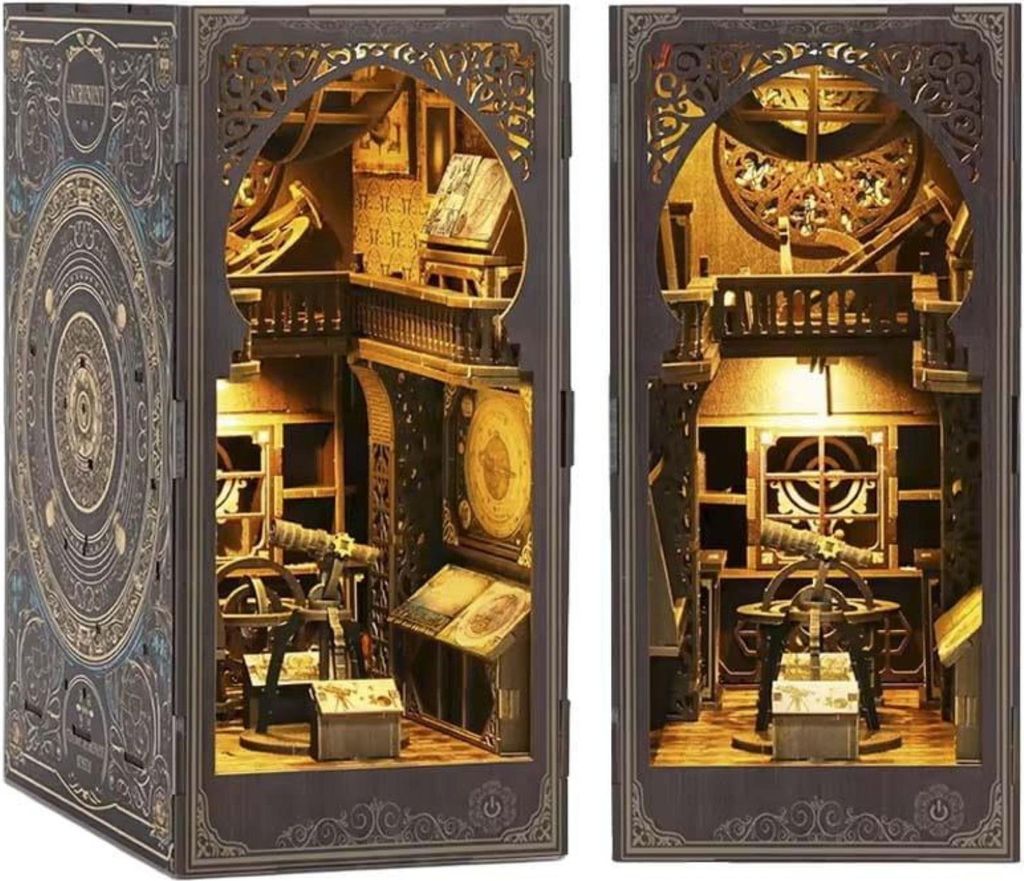 A detailed 3D model of an astronomical observatory or study, presented as a book nook insert.