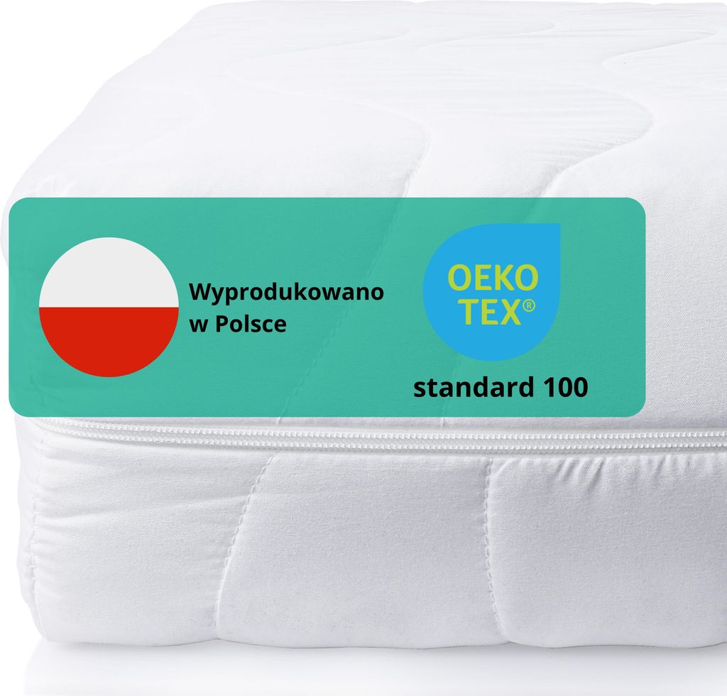 A white mattress with a green label indicating production in Poland and an OEKO-TEX certification.
