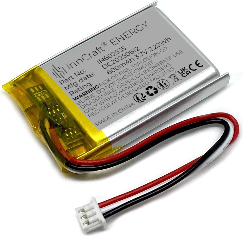 A close-up shot of a lithium-polymer battery with its connecting wires and plug.
