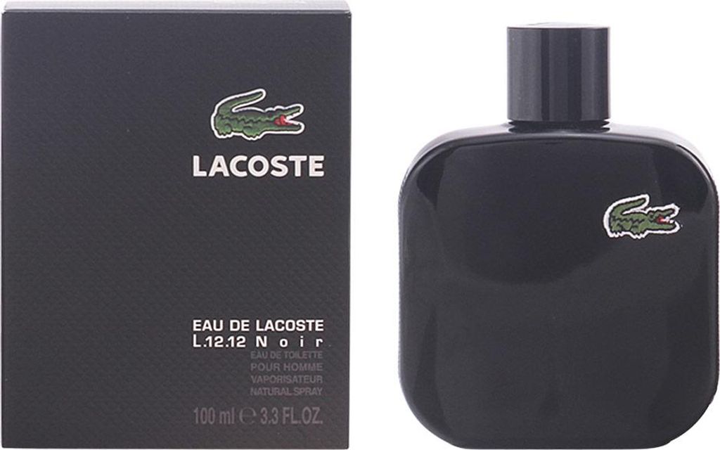 A black bottle of Lacoste Eau de Toilette and its matching black box are shown side-by-side against a white background.