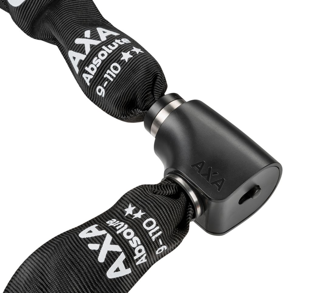 A close-up of a black bicycle chain lock with silver metal accents.