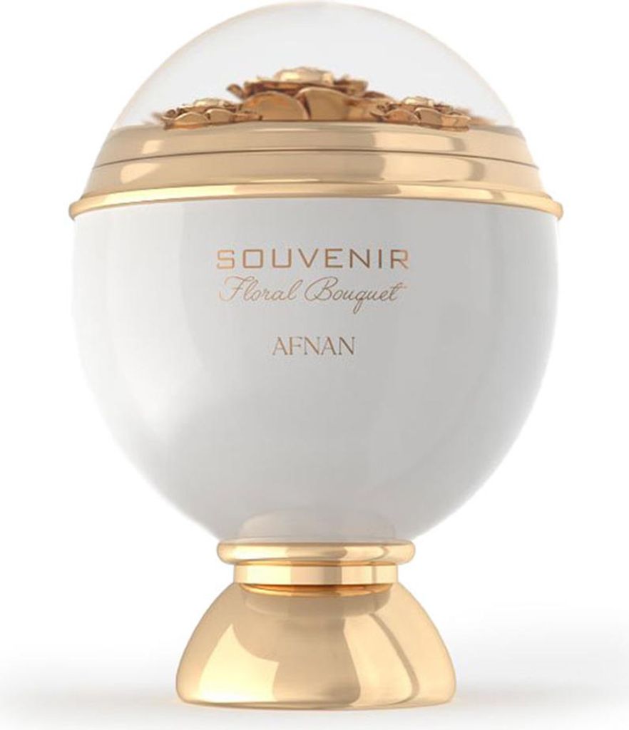 A white and gold perfume bottle with a clear dome top containing decorative gold flowers.