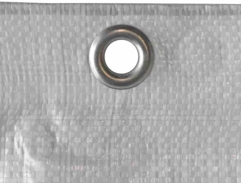 A close-up shot of a silver grommet on a white, woven tarp.