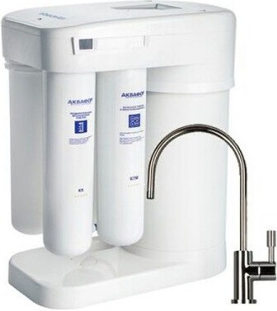 A white water filtration system with a chrome faucet.