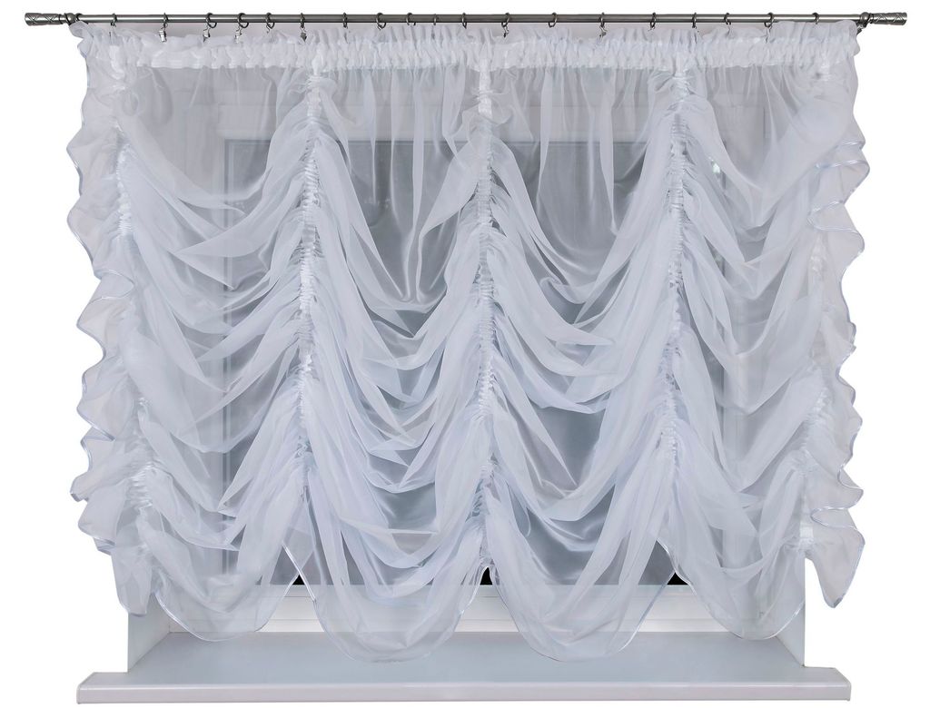 A white sheer curtain is hung on a window.