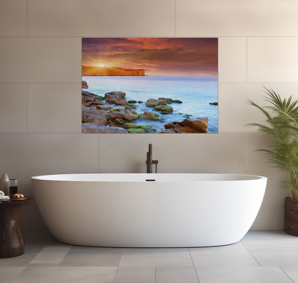 Wallario wasserfestes Poster selbstklebend 70 x 100 cm, Sonnenaufgang am Meer mit Landzunge und Felsen im Wasser, Badezimmerposter Spritzschutz mit...