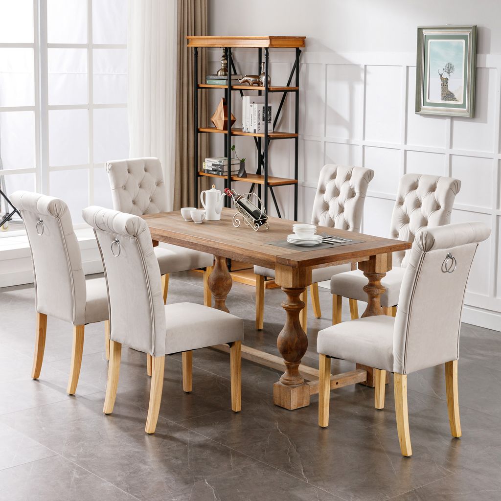 A dining room set with a wooden table and six chairs.