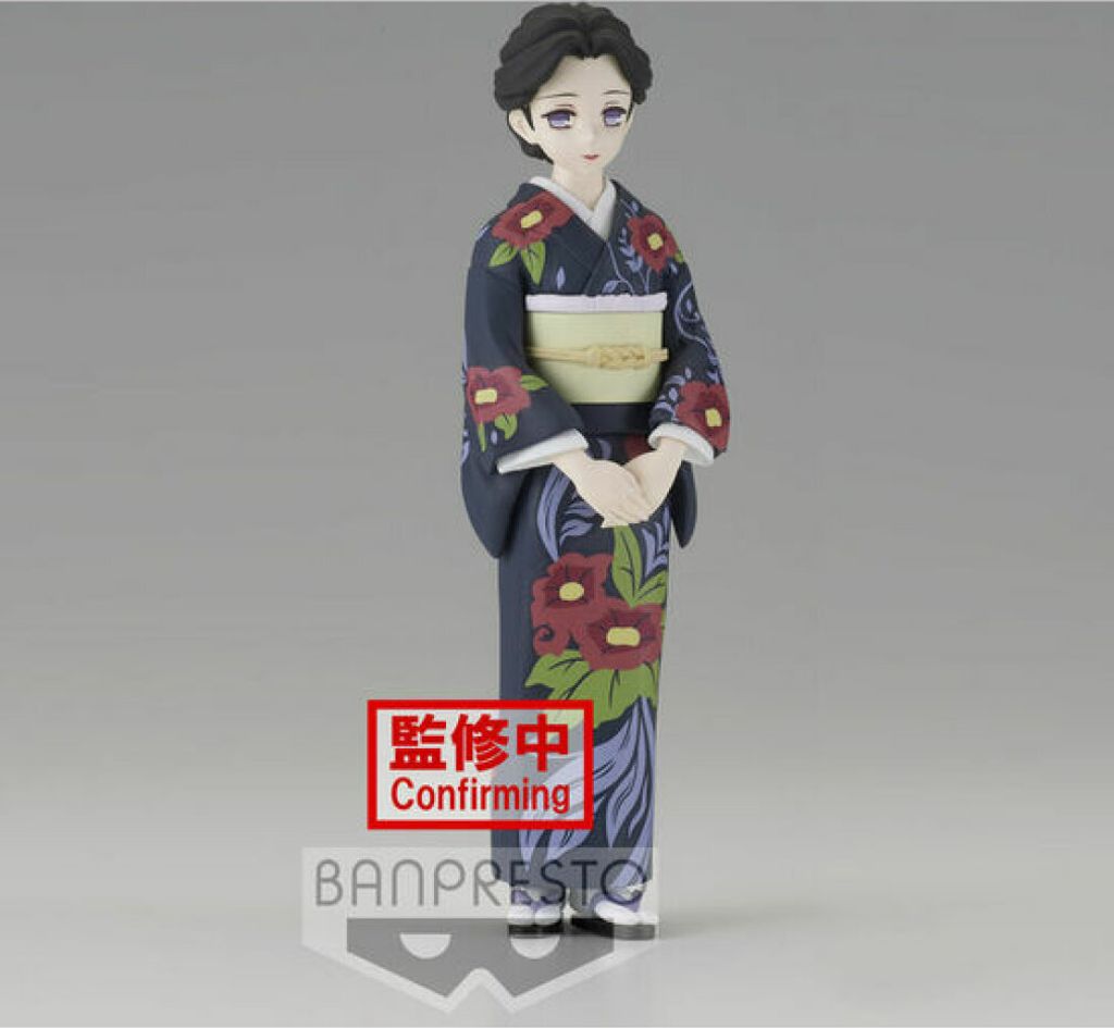A figurine of a woman in a kimono against a plain background.