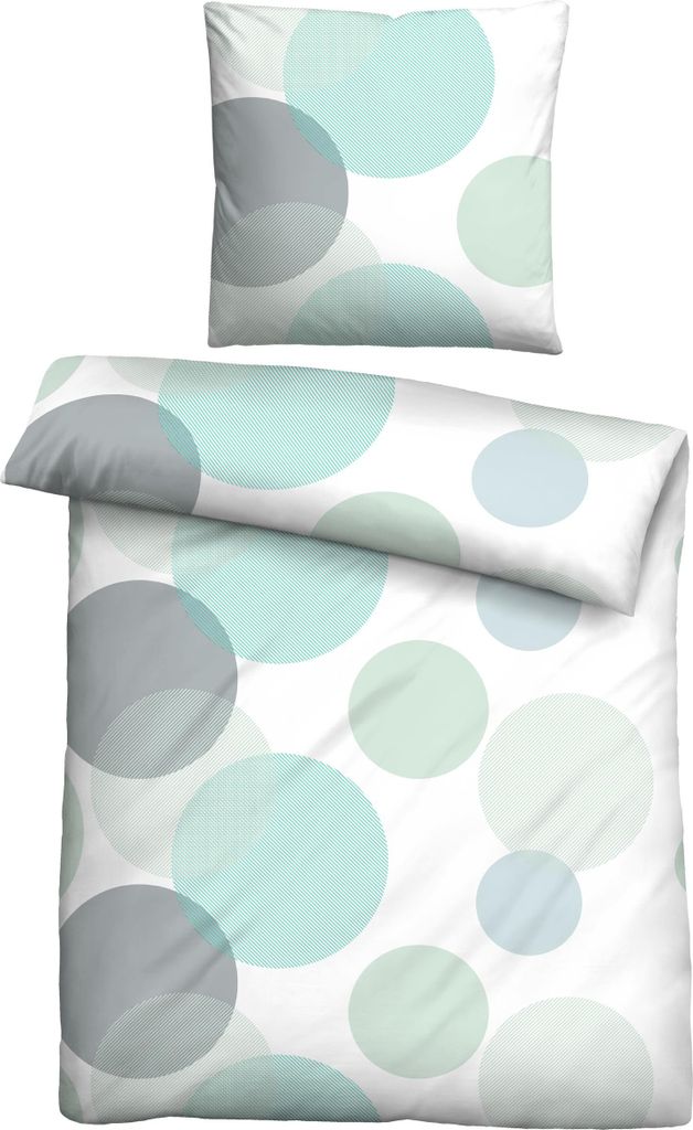 A set of bedding with a polka dot pattern.