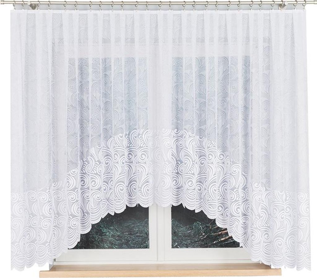 A white lace curtain with a scalloped bottom edge is shown hanging in front of a window.